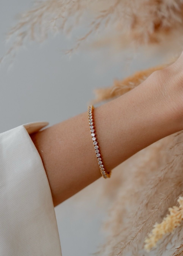 PULSEIRA RIVIERA COM ZIRCÔNIAS REDONDAS BANHADO A OURO